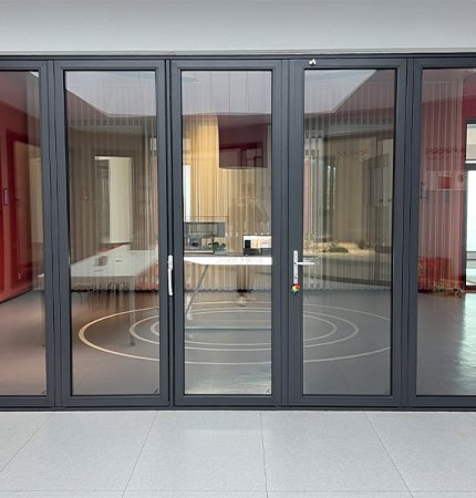 Hidden hinge folding door