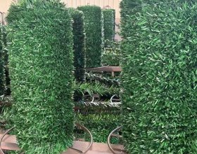 Artificial conifer fencing for green outdoor spaces