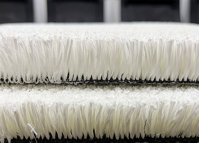 Dense white turf for artificial ski training slopes
