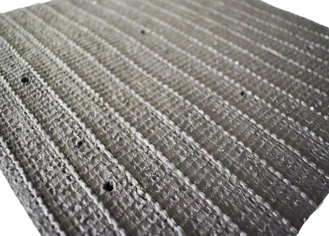 Stable backing supports S shape football turf grass