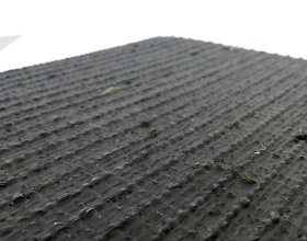 Pet friendly synthetic grass with permeable backing for easy-drain pet areas