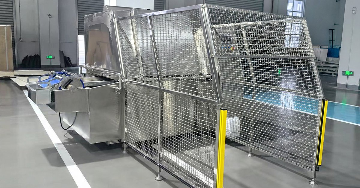 Meat trolley washer cleaning a 200L stainless steel trolley with rotating spray arm in a slaughterhouse